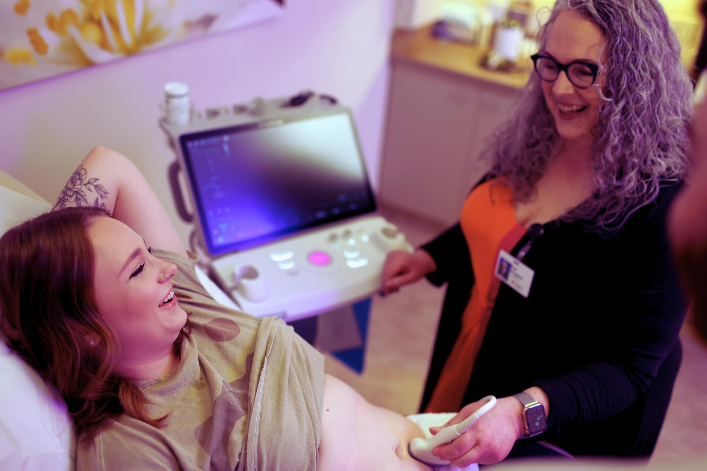 Pregnant patient receiving an early bedside ultrasound